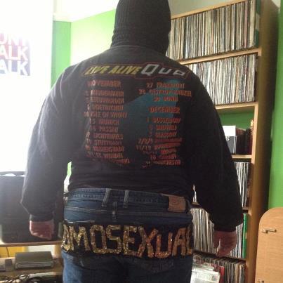 A dyke wears a Status Quo tour sweatshirt, Homosexual Death Drive shorts, balaclava