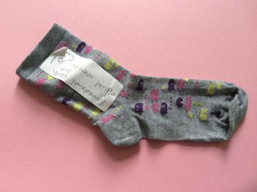 Sock with hand drawn label staped to it