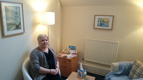 Fishing, a painting by Stewart Irwin, with Anna in her therapy room