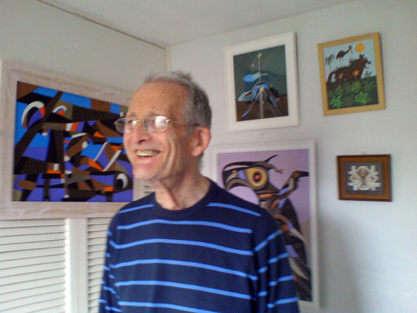 Stewart Irwin with some of his paintings in his studio at home